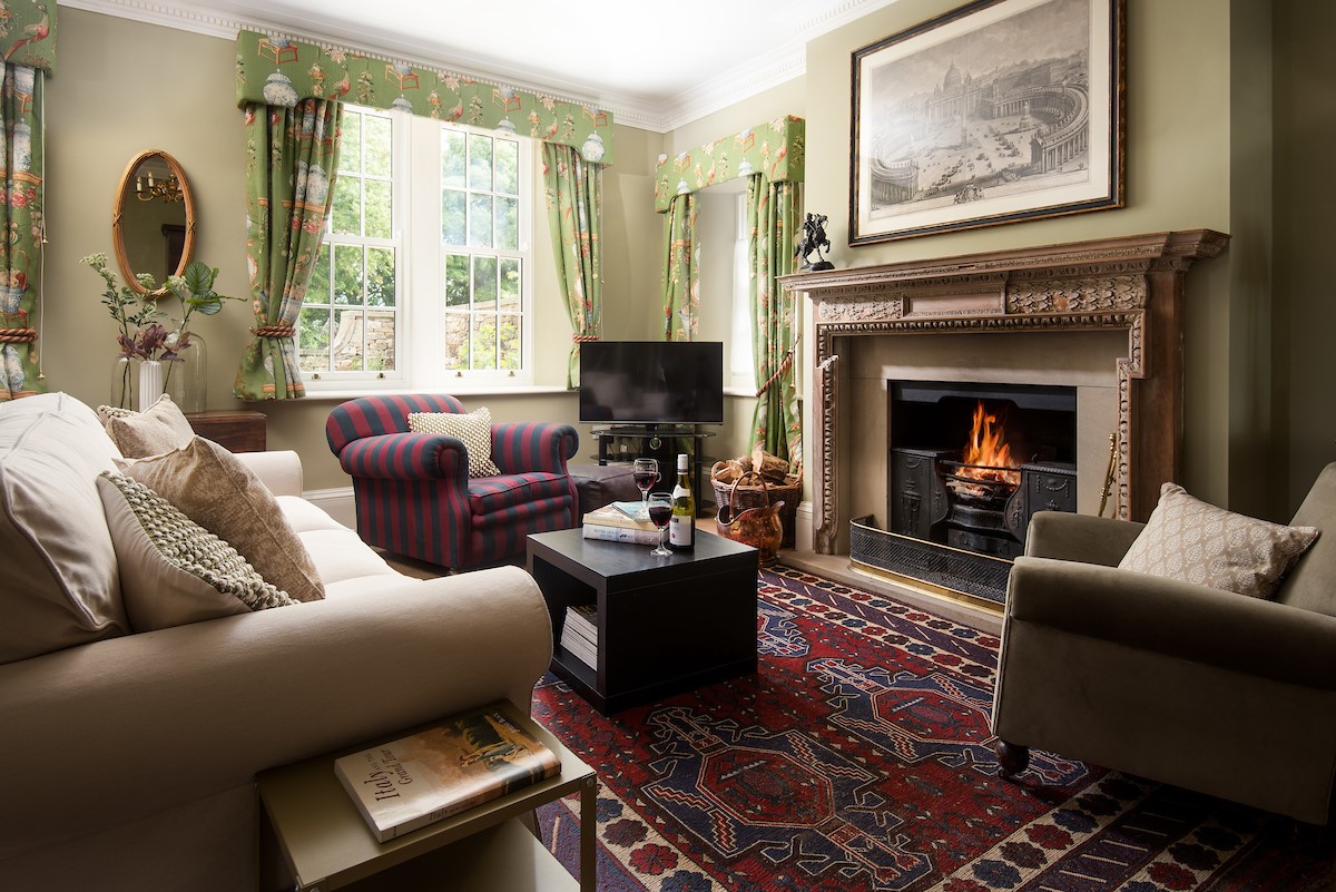 Birks Stable Cottage - three seater sofa, two armchairs, Smart TV and open fire in the sitting room