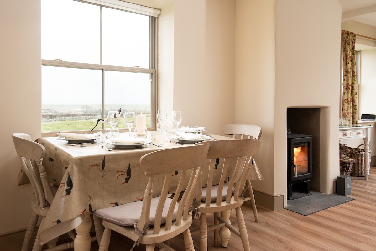 Bee Cottage - dinning table seating four guests and offering fabulous views across to Holy Island