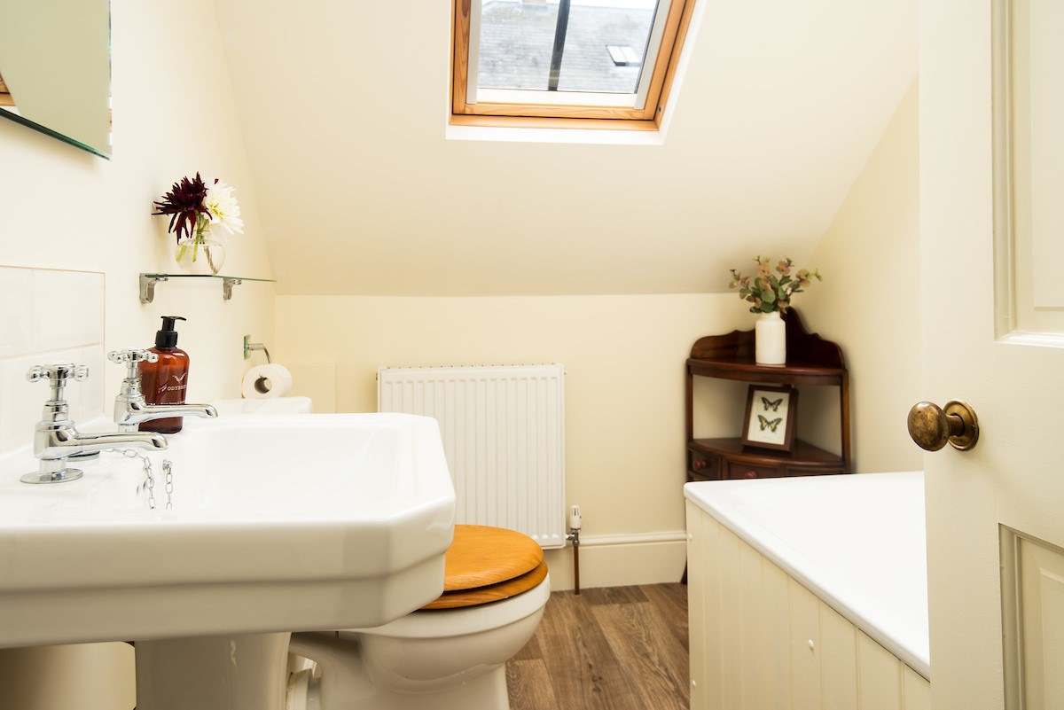 Birks Stable Cottage - family bathroom on the first floor with bath, basin and WC