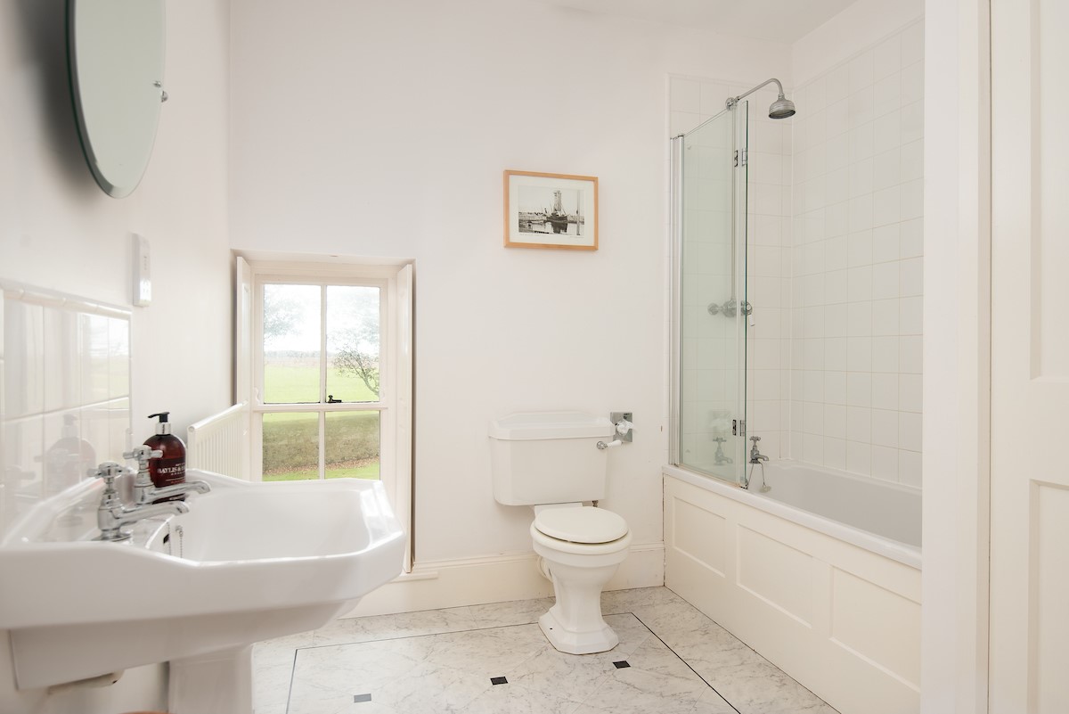 The Old Vicarage - family bathroom with shower over bath, WC and basin