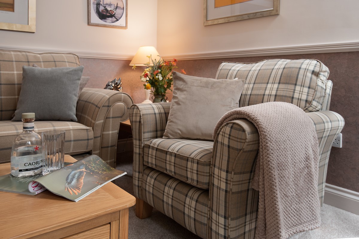 Eildon View - armchair with cosy blanket to snuggle up with your drink of choice