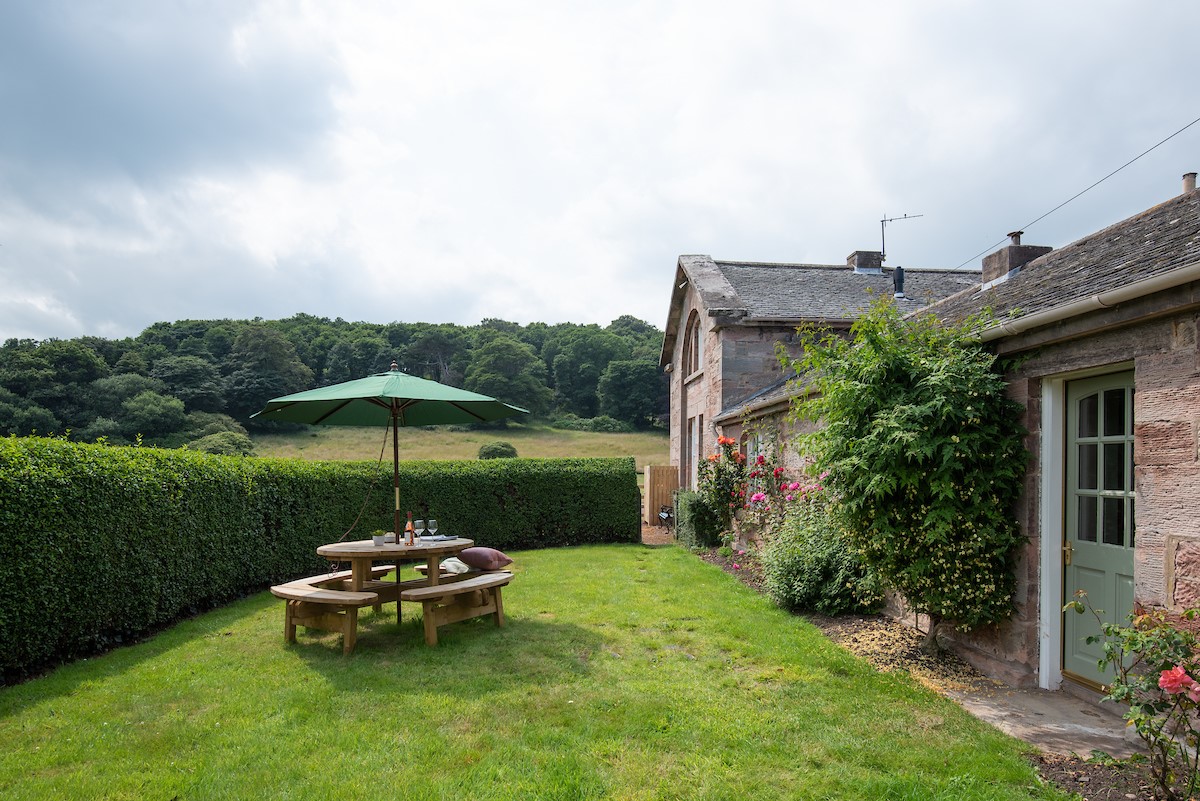 Laurel Cottage - outdoor seating area within the private lawned garden