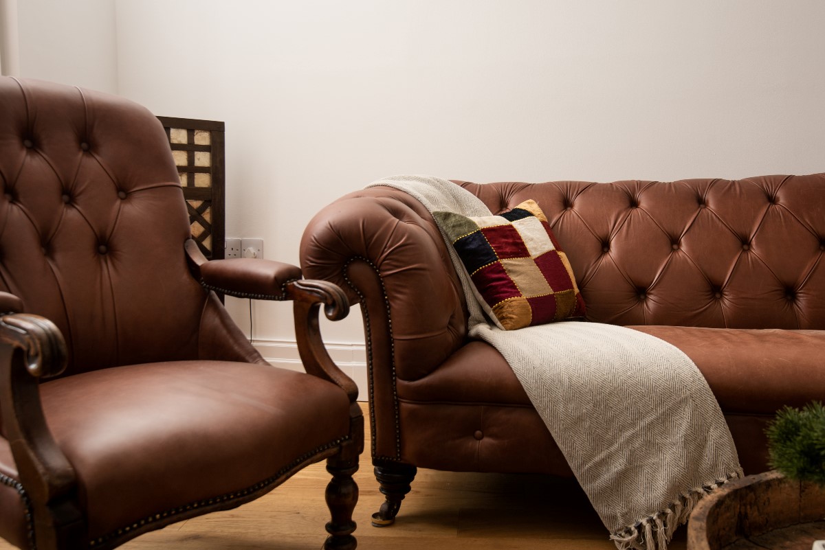 Number One Clayport Street - the leather sofa and chair in the snug