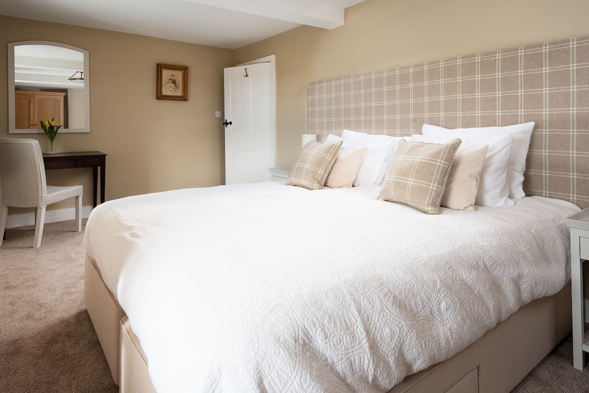Grange House - bedroom one with zip and link bed that can be configured as a super king size double or twins