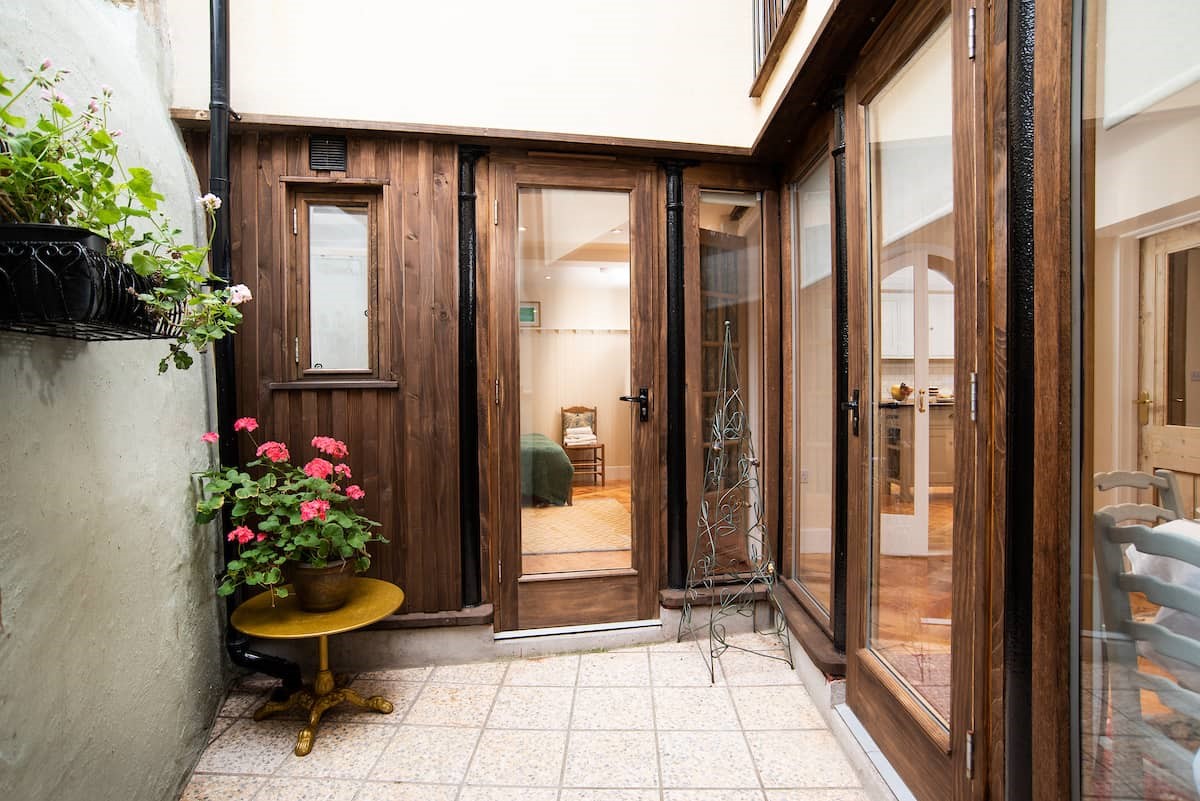 The Woodworker's Cottage - compact courtyard, accessed from bedroom one and the dining area