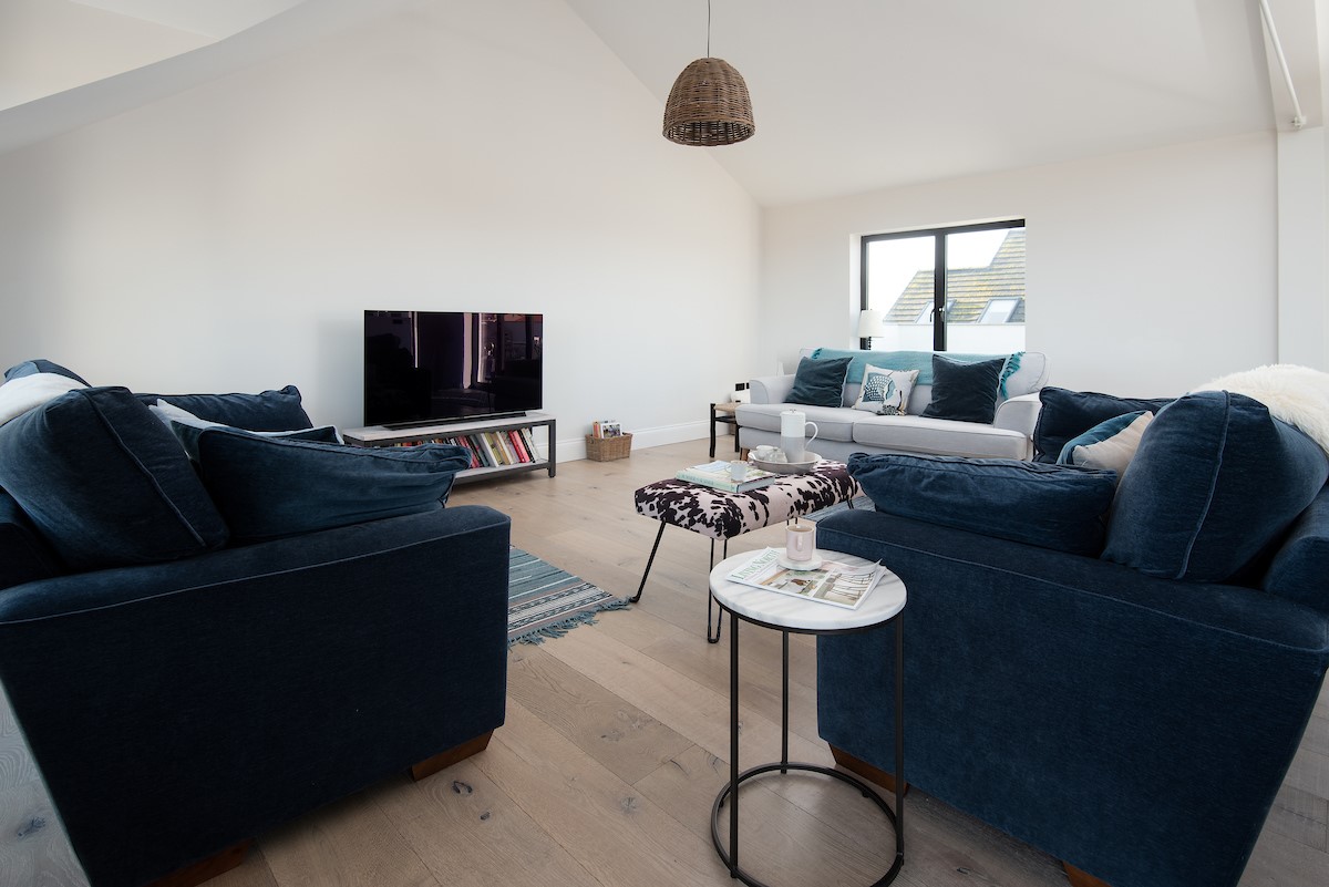 Seaside House - bright and airy sitting room with comfortable sofas, coffee table and Smart TV