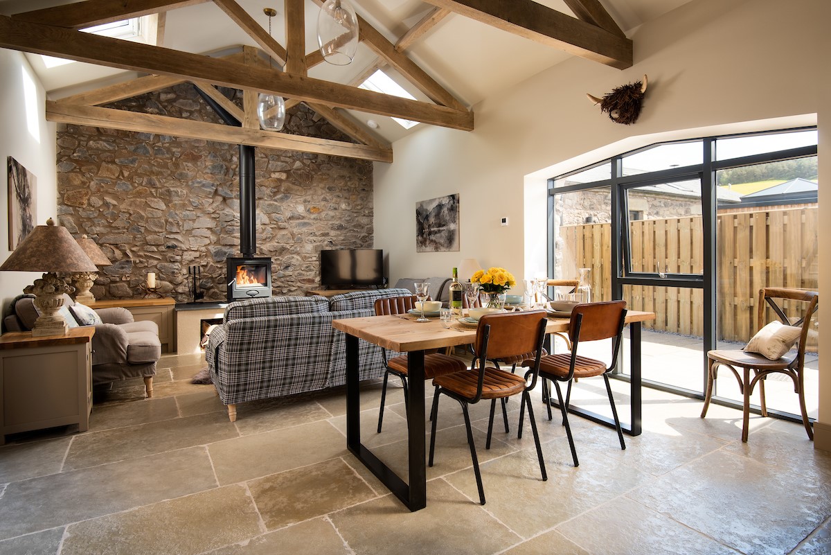 The Old Byre at West Moneylaws - the open plan living areas with floor to ceiling windows