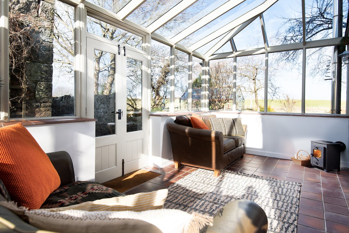 The Old School House - a heated conservatory with compact wood burner
