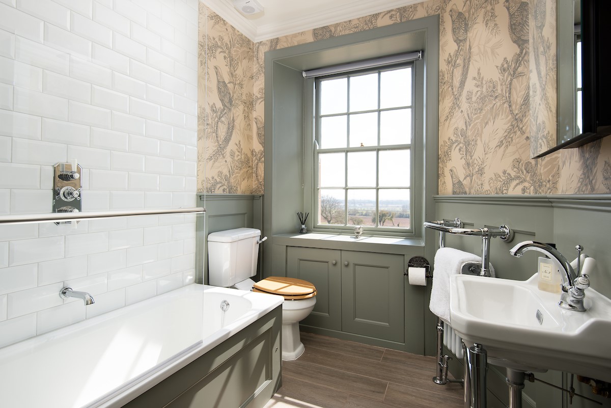 Cairnbank House - family bathroom on the first floor with bath and basin which serves the two attic bedrooms