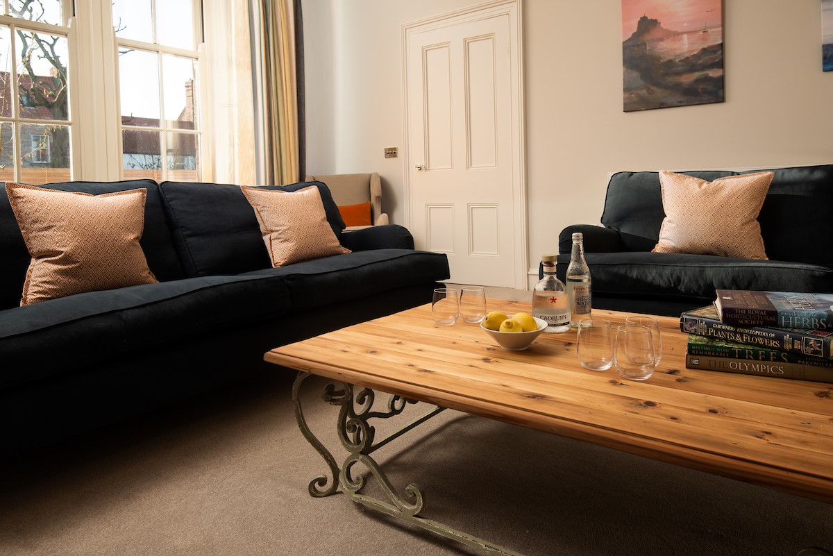 Cambridge House - relax by the wood burning stove in the cosy sitting room