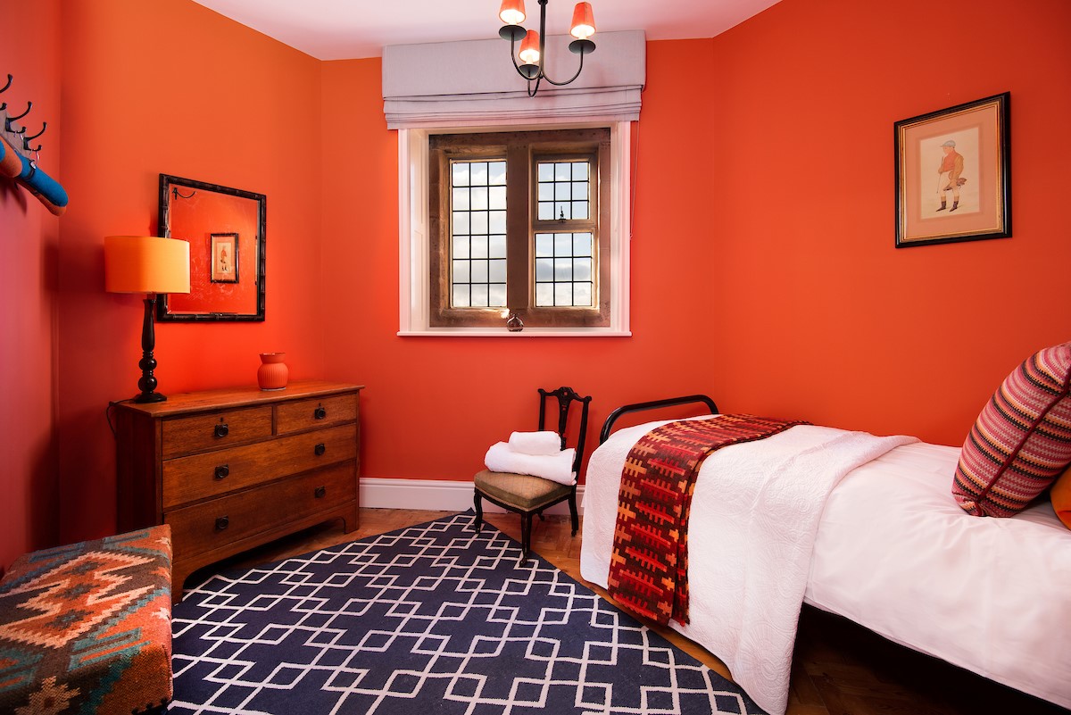 The Clock Tower at Bamburgh Castle - single bedroom in vibrant orange