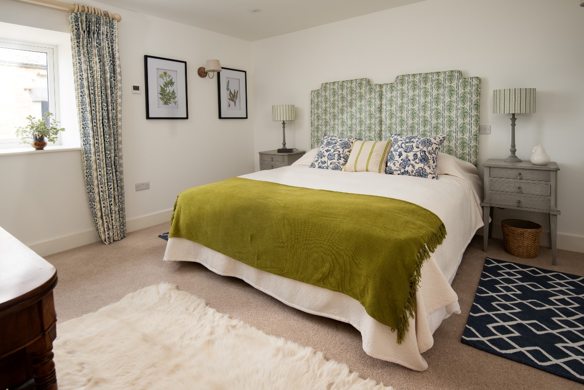 Brunton Lake - bedroom one with zip and link beds, bedside tables with lamps, and open wardrobe