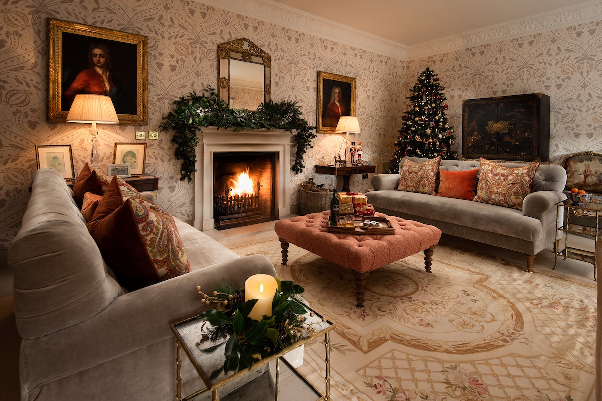Broadgate House - gather in the drawing room to swap Christmas presents with friends and family