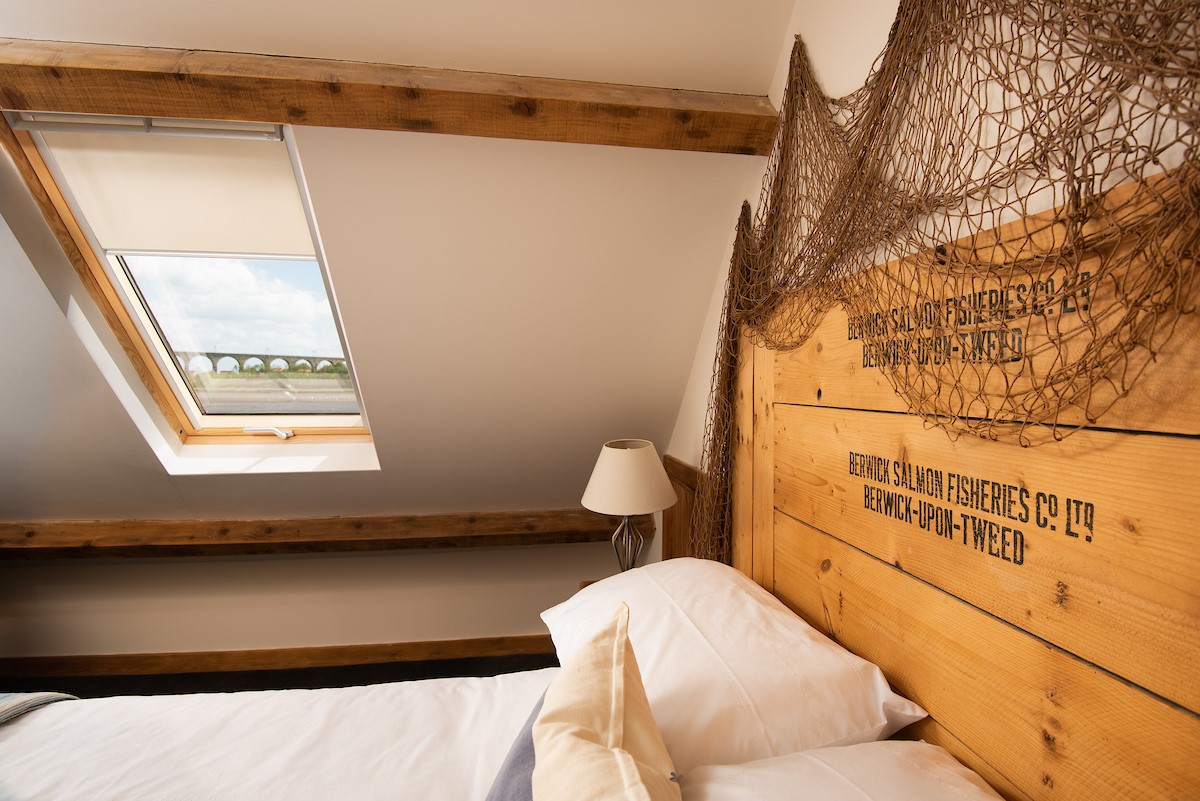 Whitesand Shiel - the bedroom with unique headboard and views of the Royal Border Bridge