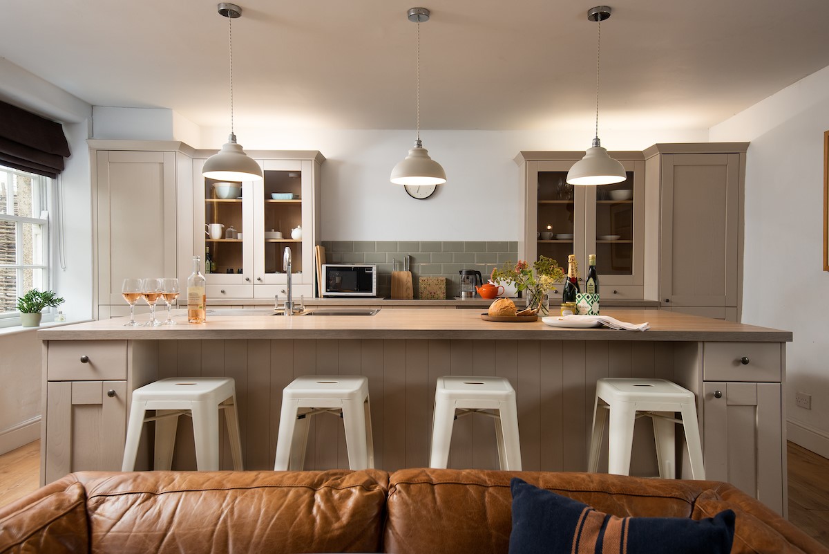 Cuthbert House - kitchen island with breakfast bar and four stools