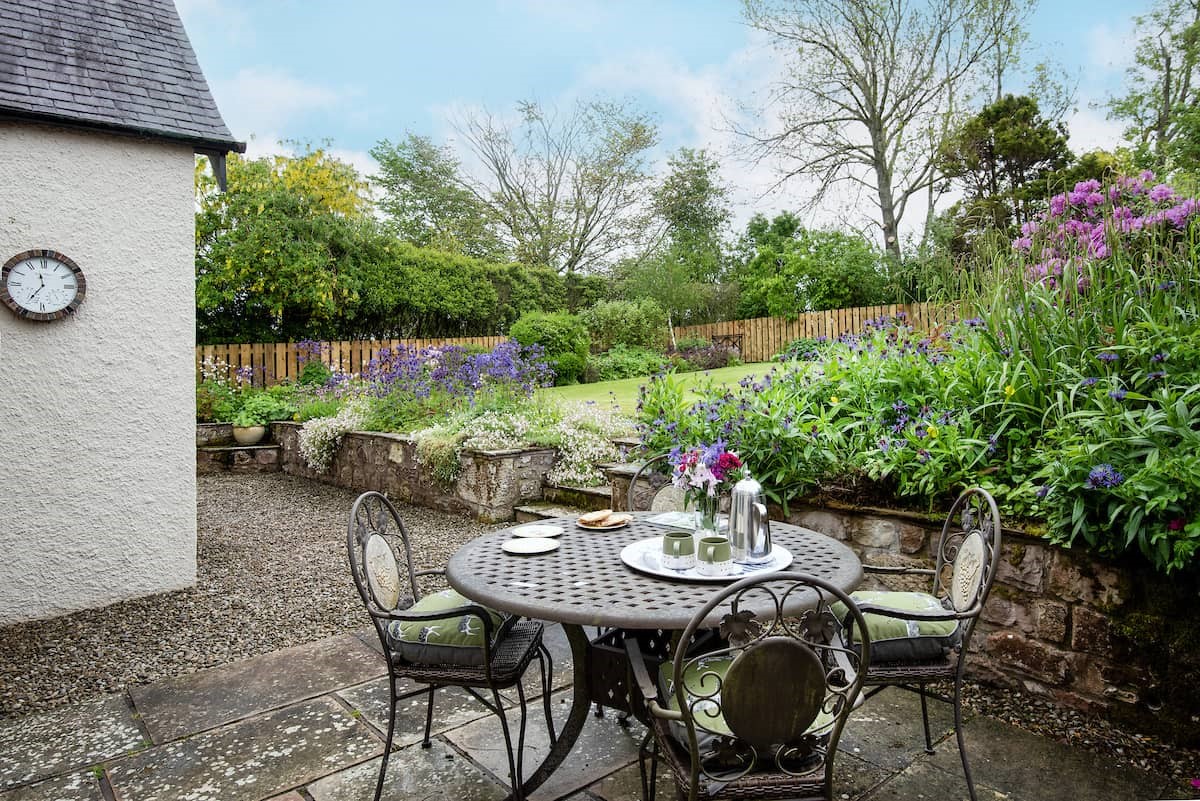 Pentland Cottage - outside dining space for four guests in the pretty rear garden