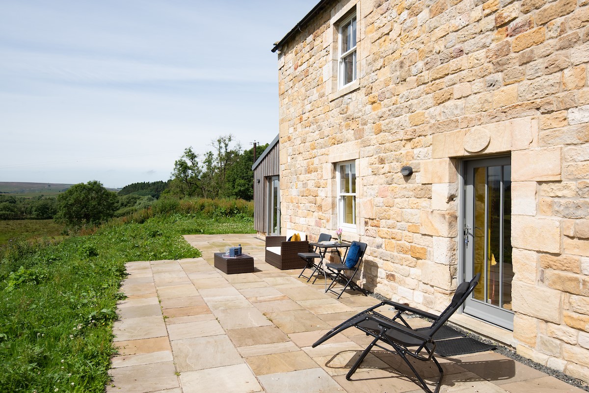 Lowtown Cottage - outdoor furniture for guests to relax on the patio