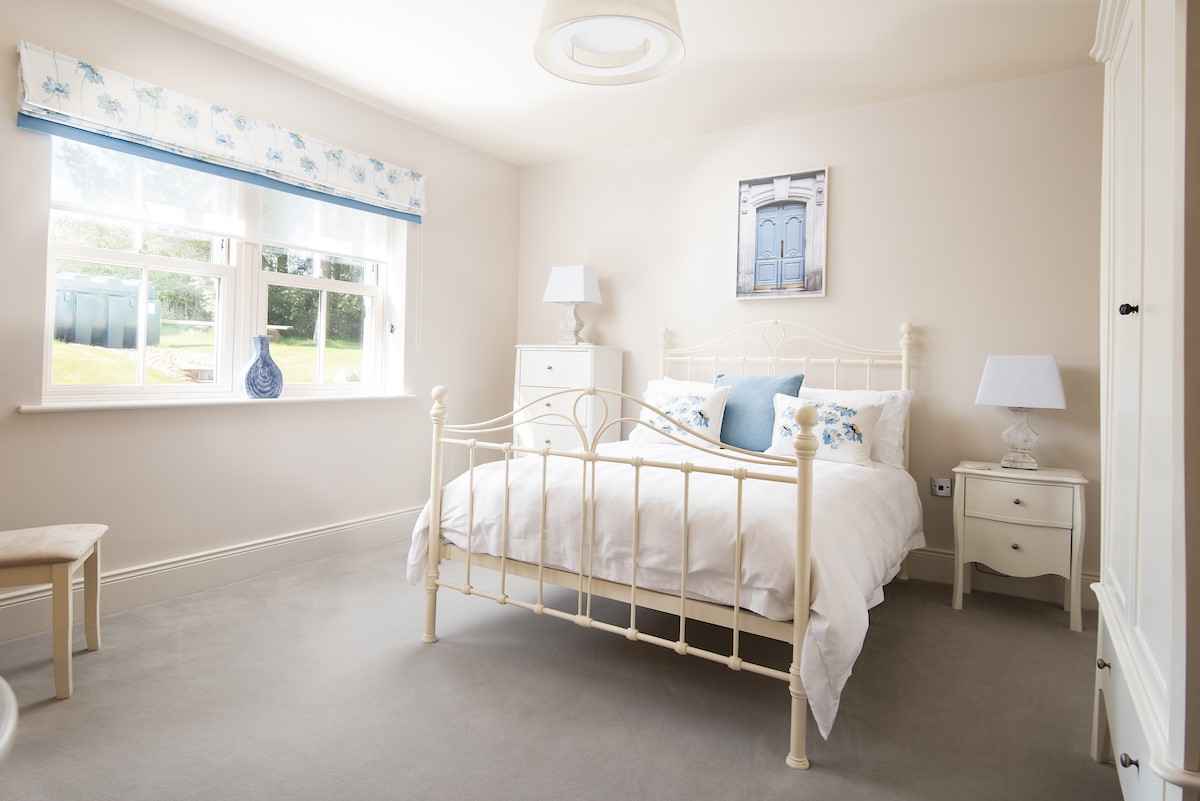 Bracken Lodge - bedroom two is bright and airy, with a double bed and large wardrobe