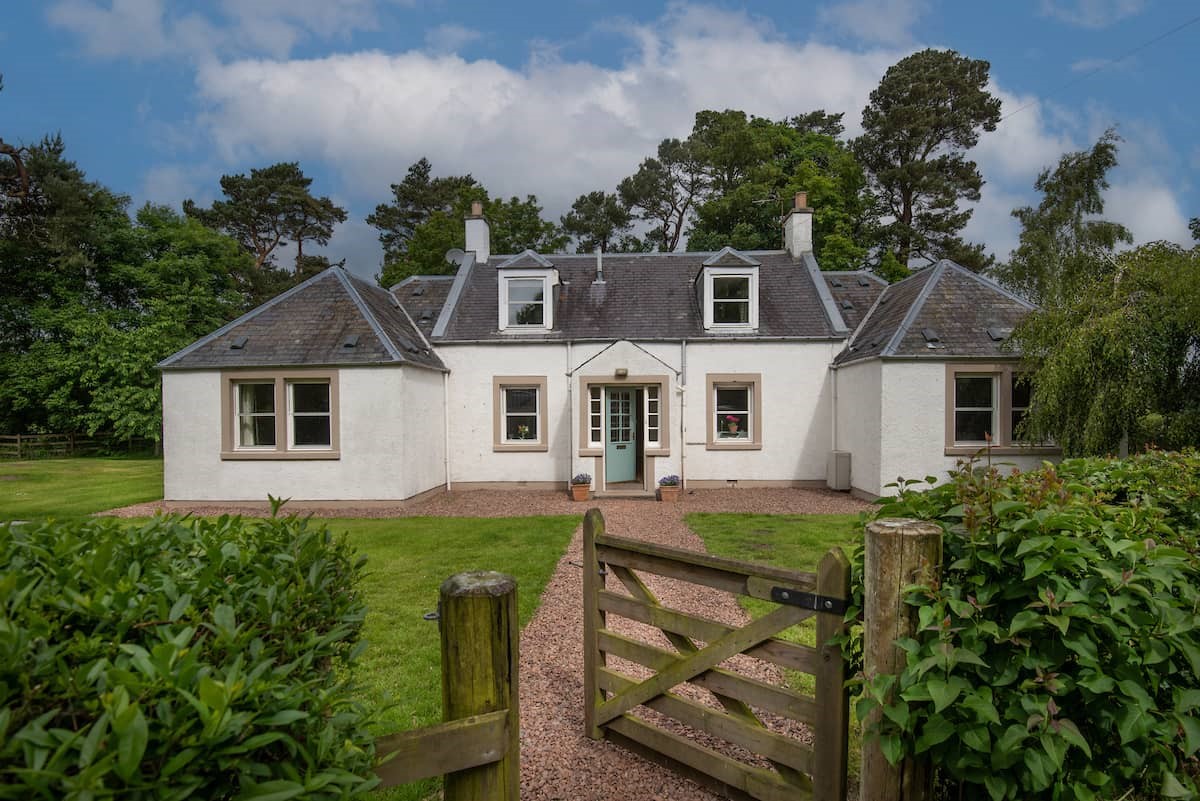 Pirnie Cottage - pretty cottage exterior with gated entrance into the garden