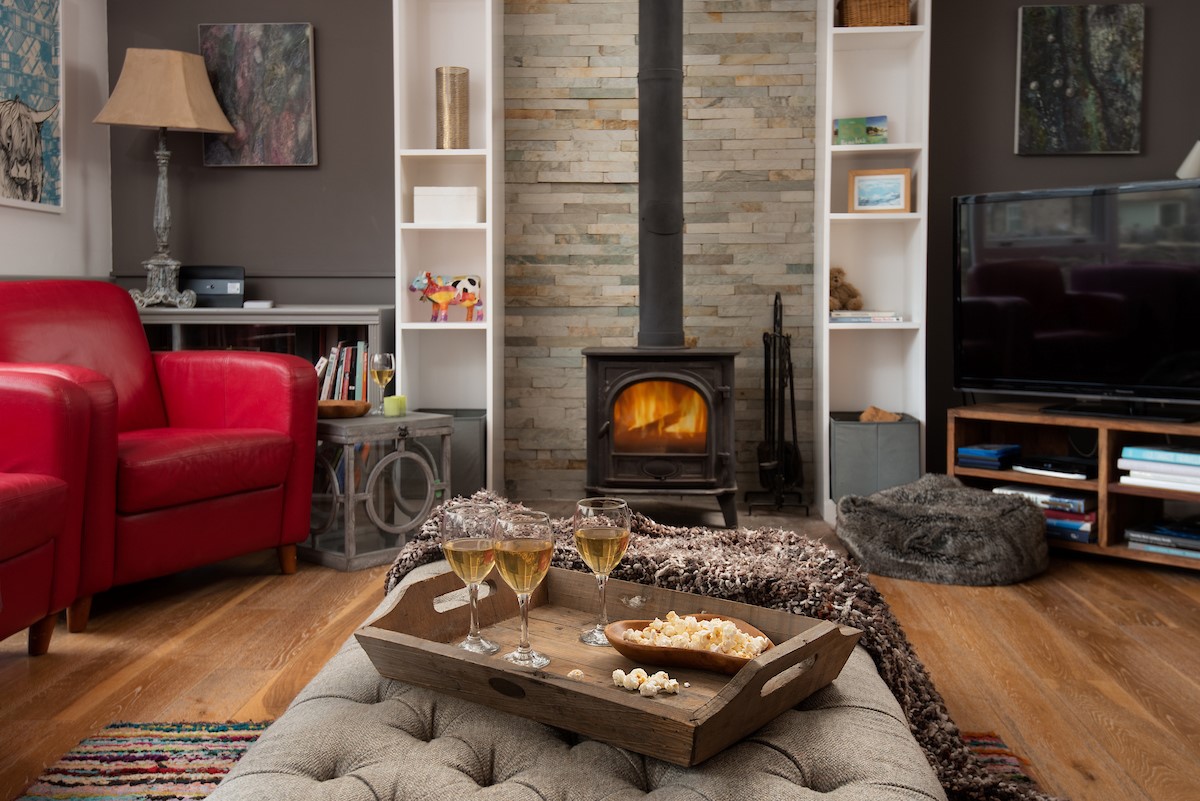 Moo House - relax in the cosy sitting room in front of the log burner