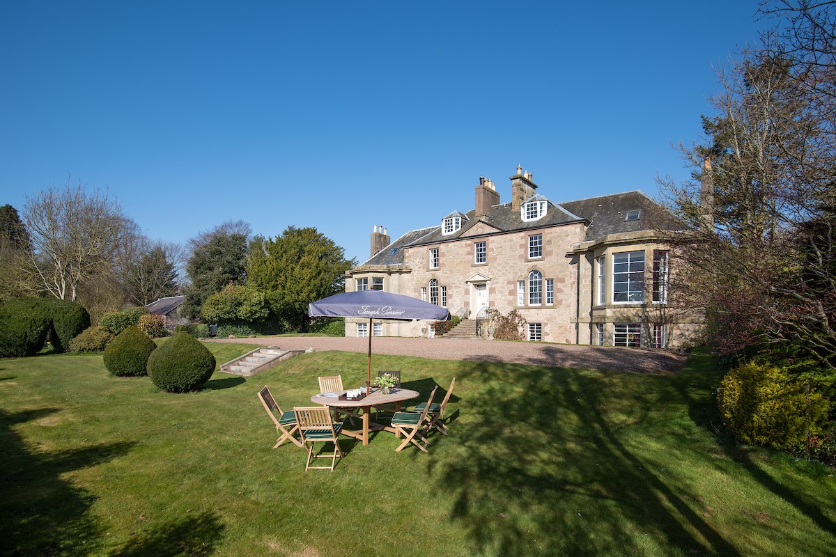 Cairnbank House - the impressive lawned garden to the front of the property with garden furniture