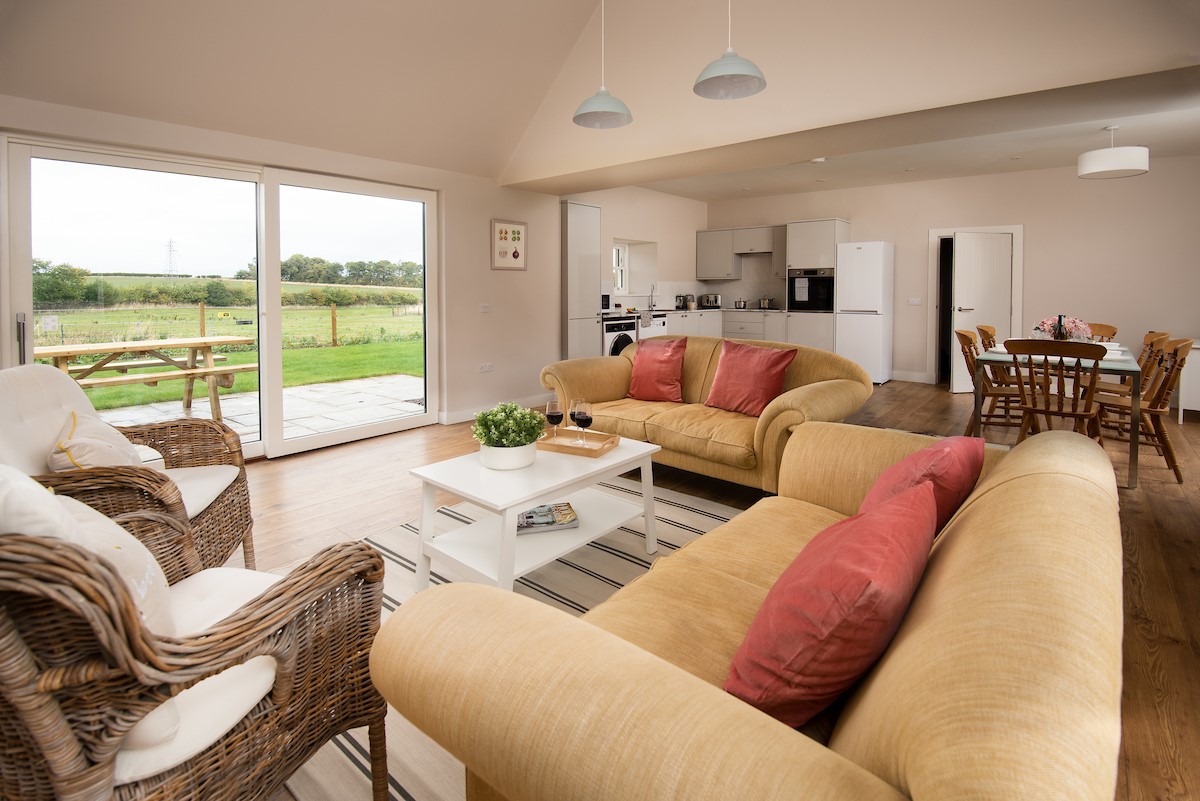 Coldwells Farmhouse - the open-plan living space with views out to the garden and surrounding fields