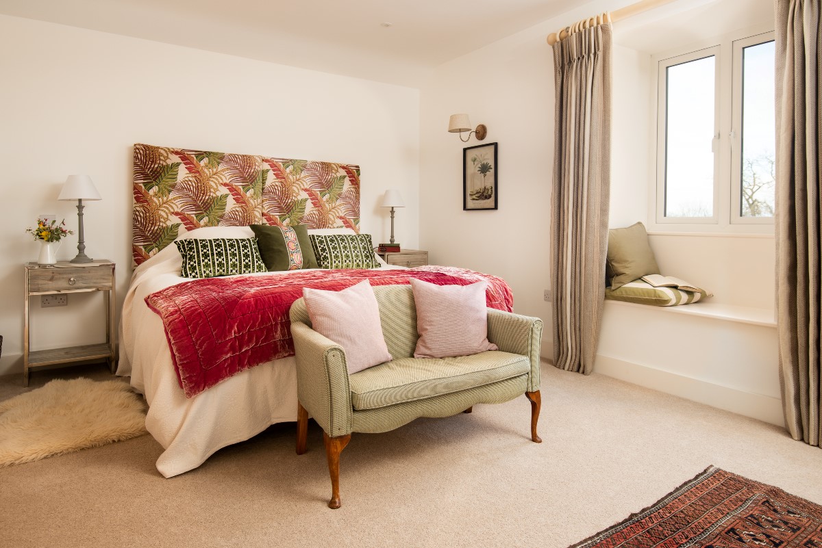 Swallow Dean - super king zip and link bed in the bedroom with window seat offering lovely country views