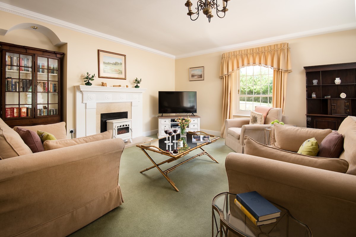 Eslington Lodge - sitting room with cosy 'coal-effect' fire and SmartTV