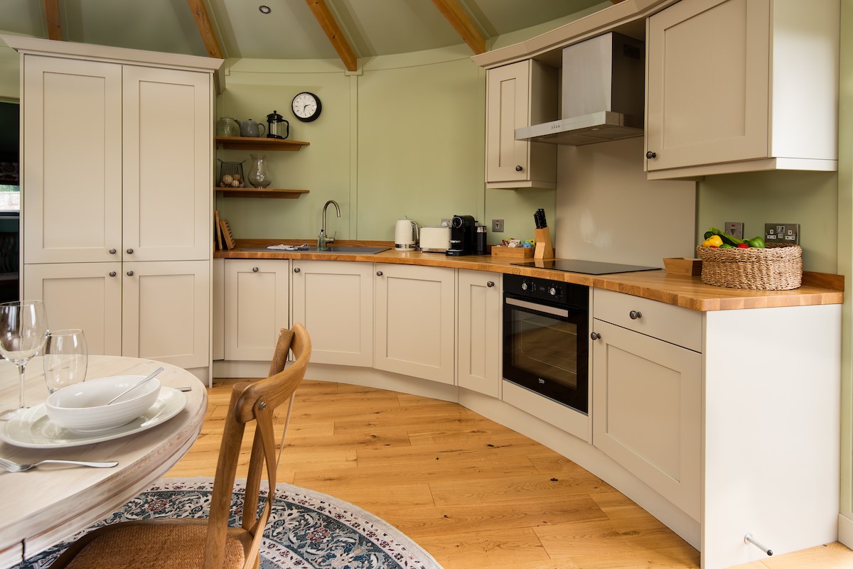 The Treehouse - the curved Shaker-style kitchen is well-equipped