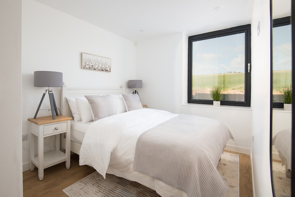 3 The Bay, Coldingham - king size bed in bedroom one