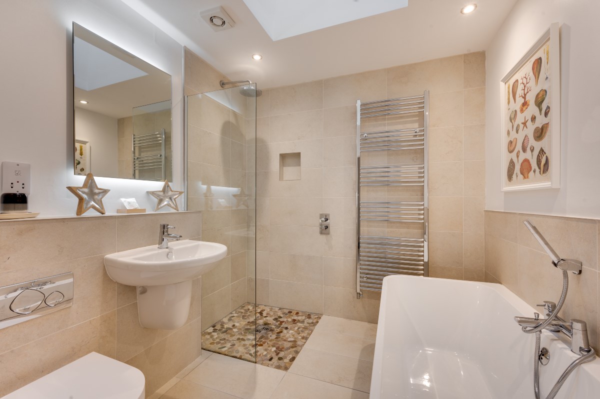 Samphire Barn - ground floor family bathroom with walk-in shower, double ended bath with shower attachment, WC and basin