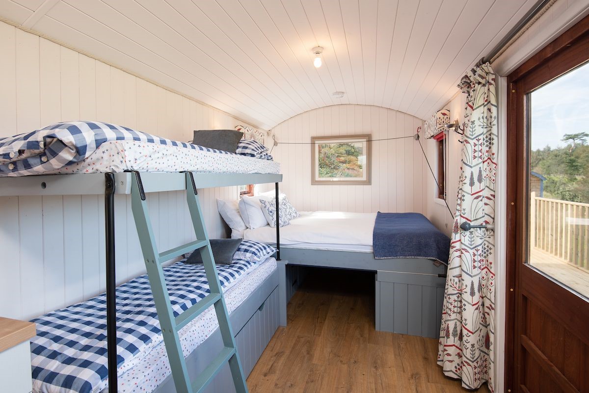 Foxglove - bedroom area with king size bed and full size bunk beds
