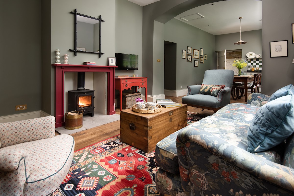 Stable Cottage, Glanton Pyke - the cosy sitting room area in the open plan space
