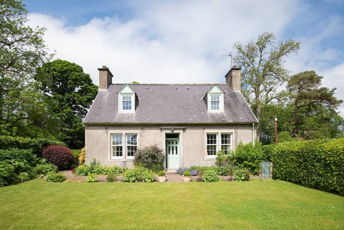 Lane Cottage - front aspect of the property set within a very attractive fully-enclosed garden