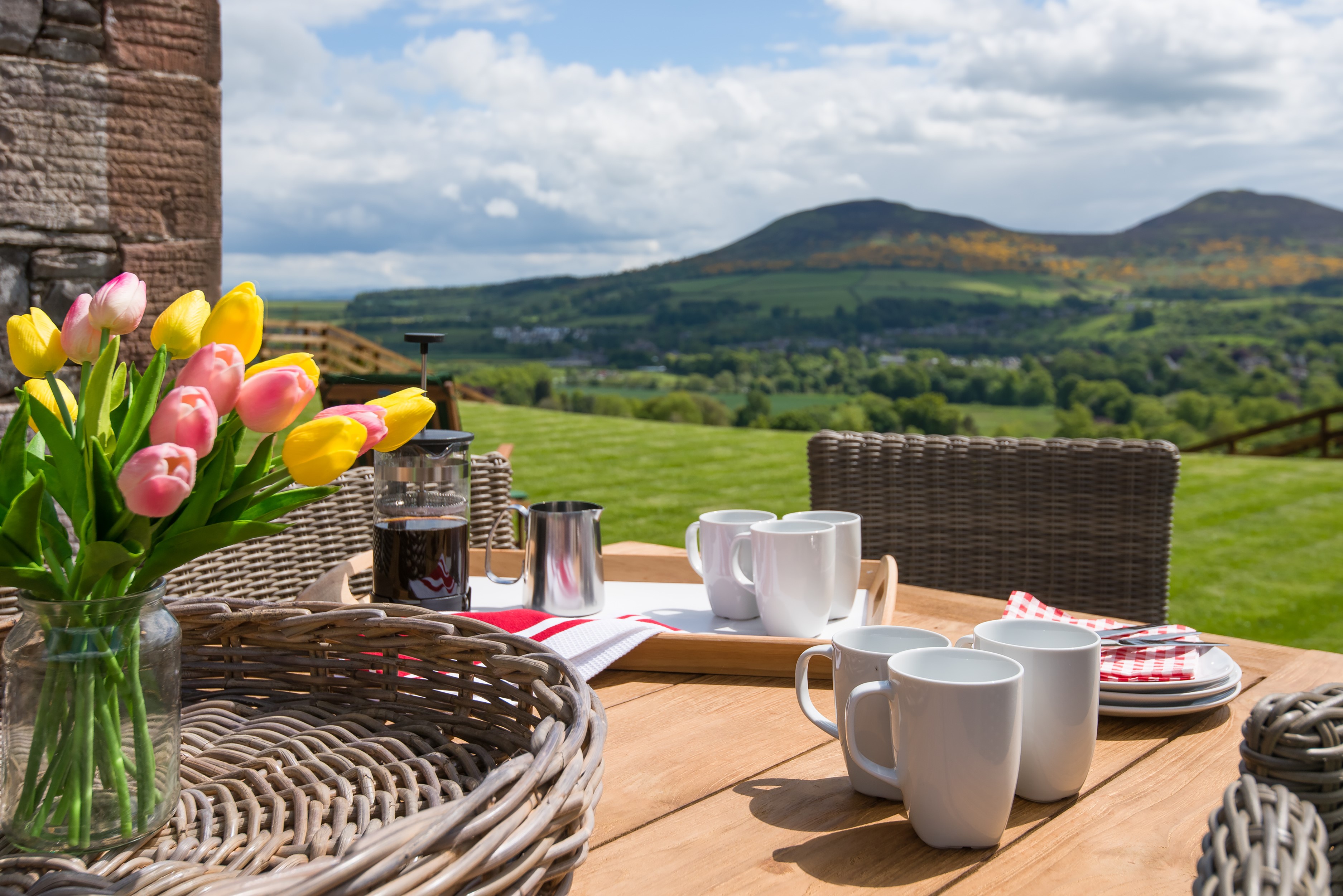 Granary - sunny outdoor seating area overlooking the Eildon hills