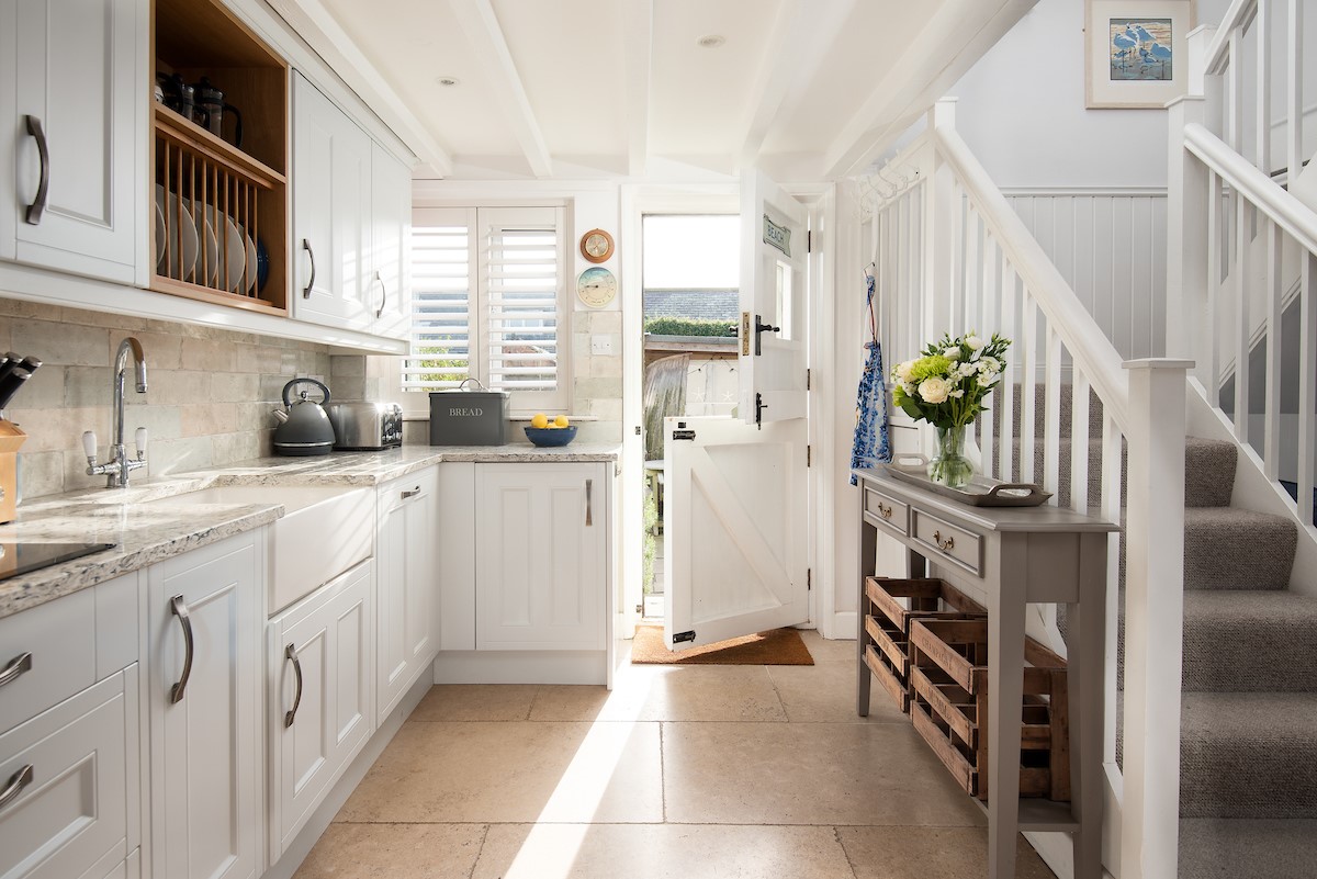 The Arch - bright, well-equipped kitchen with Dutch door leading out to the patio garden