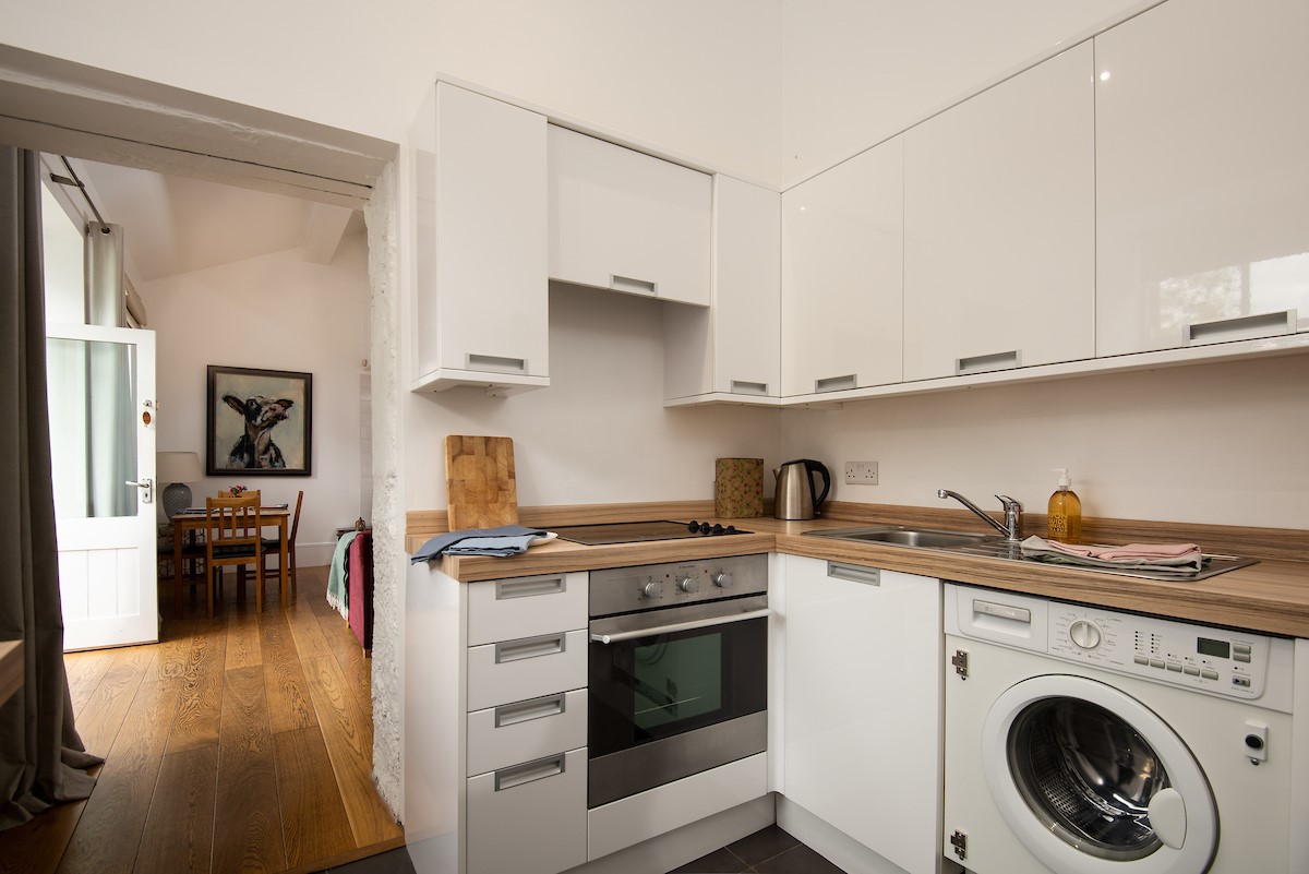 Priory Cottage - well-equipped kitchen with oven, dishwasher, fridge, small freezer and washing machine