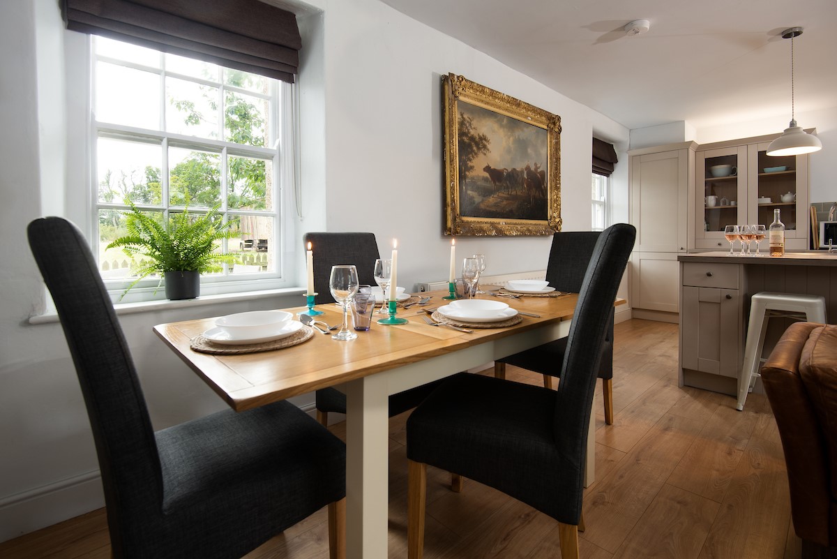 Cuthbert House - large dining table with seating for 4 guests