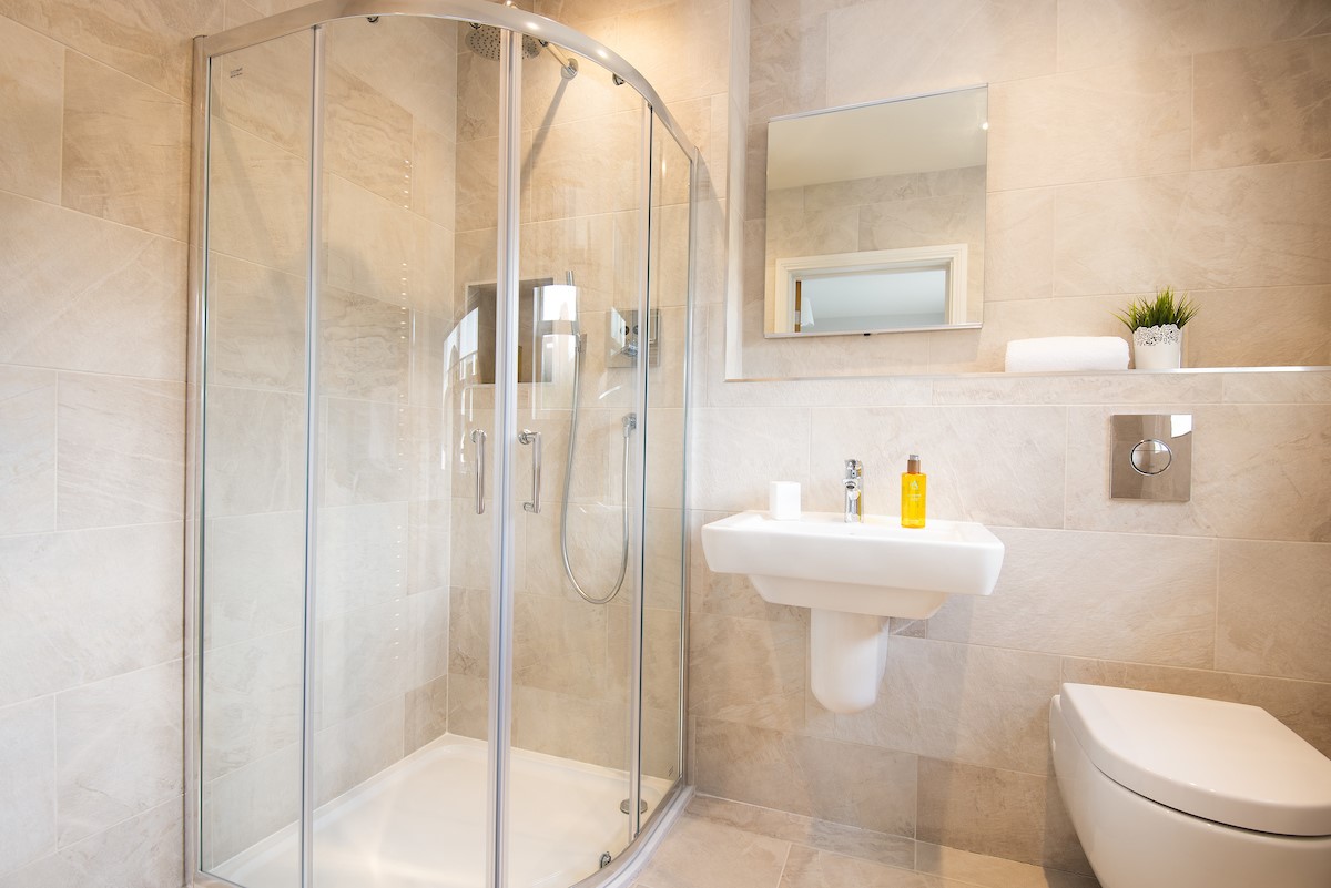 Bracken Lodge - en suite of bedroom two with corner walk-in shower with a rainfall shower head