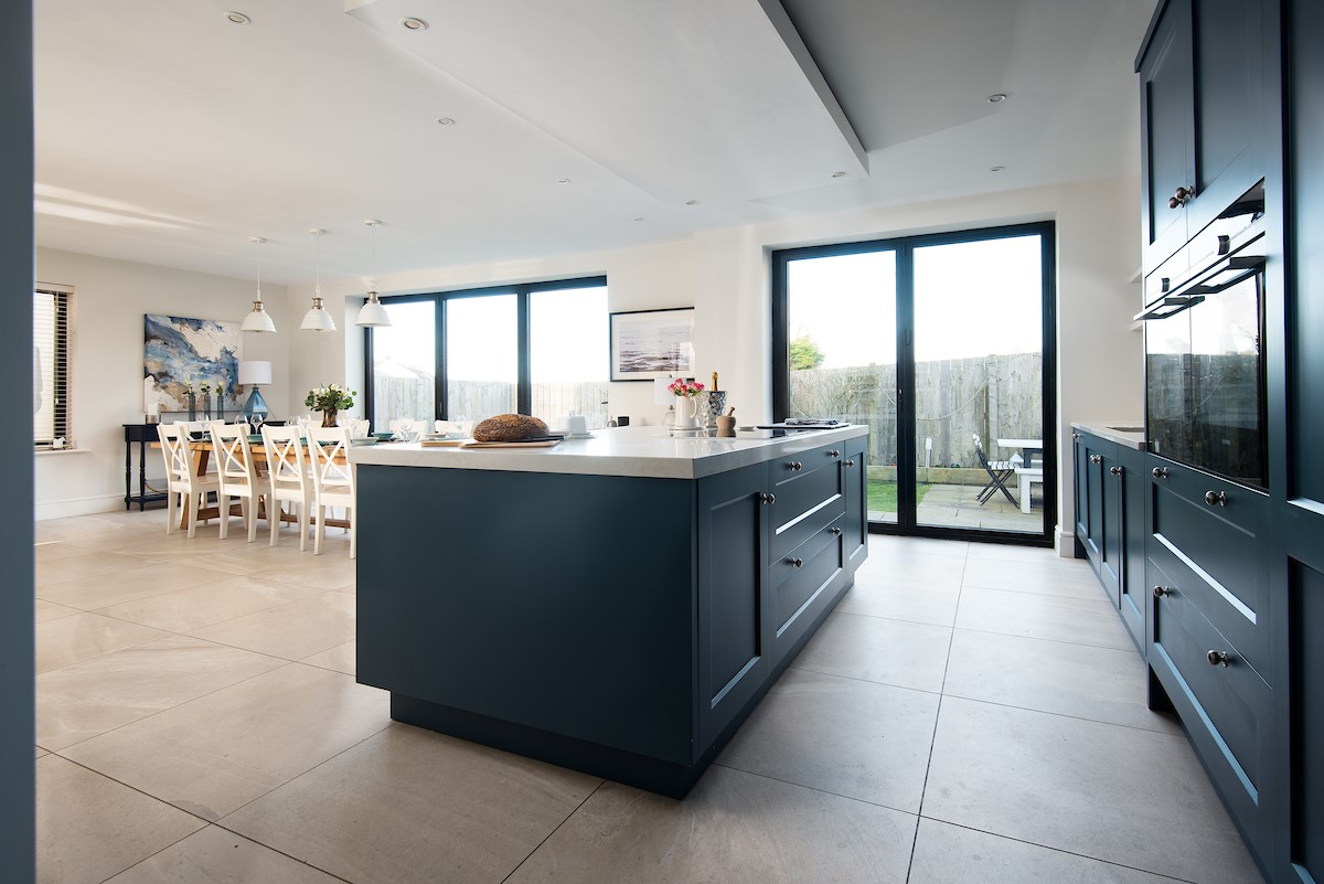 Duneside House - open-plan kitchen and dining area creating a large, bright space