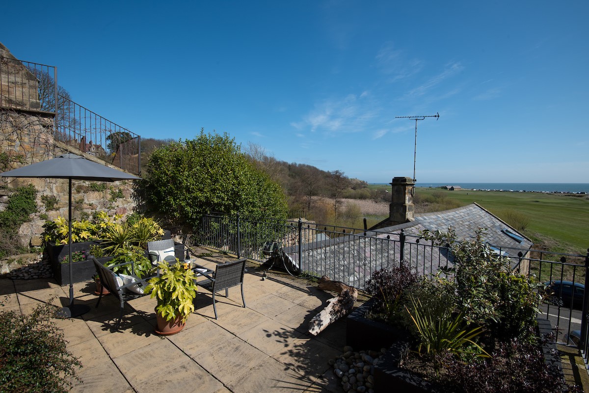 Marine House Cottage - spacious terrace with views over Alnmouth golf course and coastline