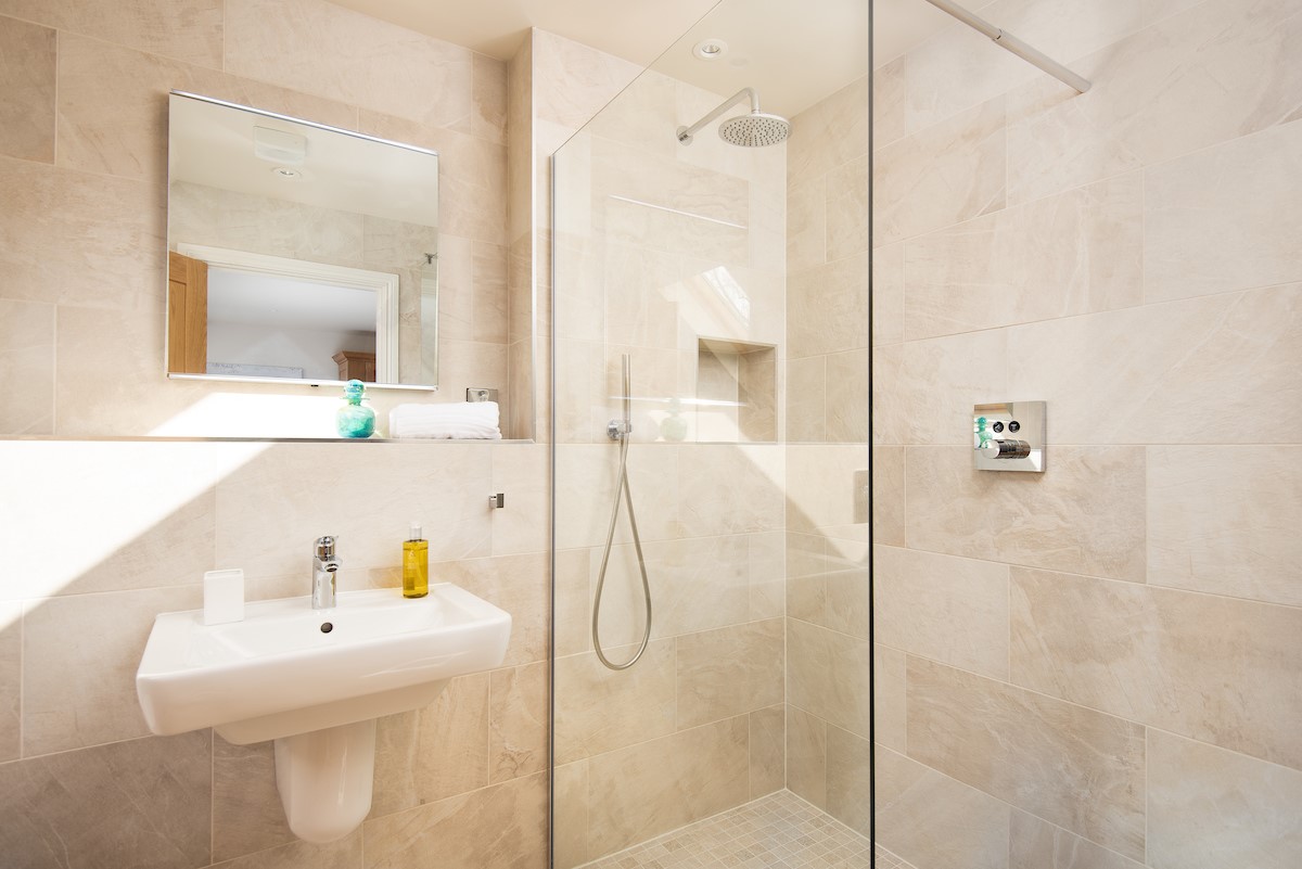 Bracken Lodge - the en suite of bedroom four has a large walk-in shower with rainfall shower head