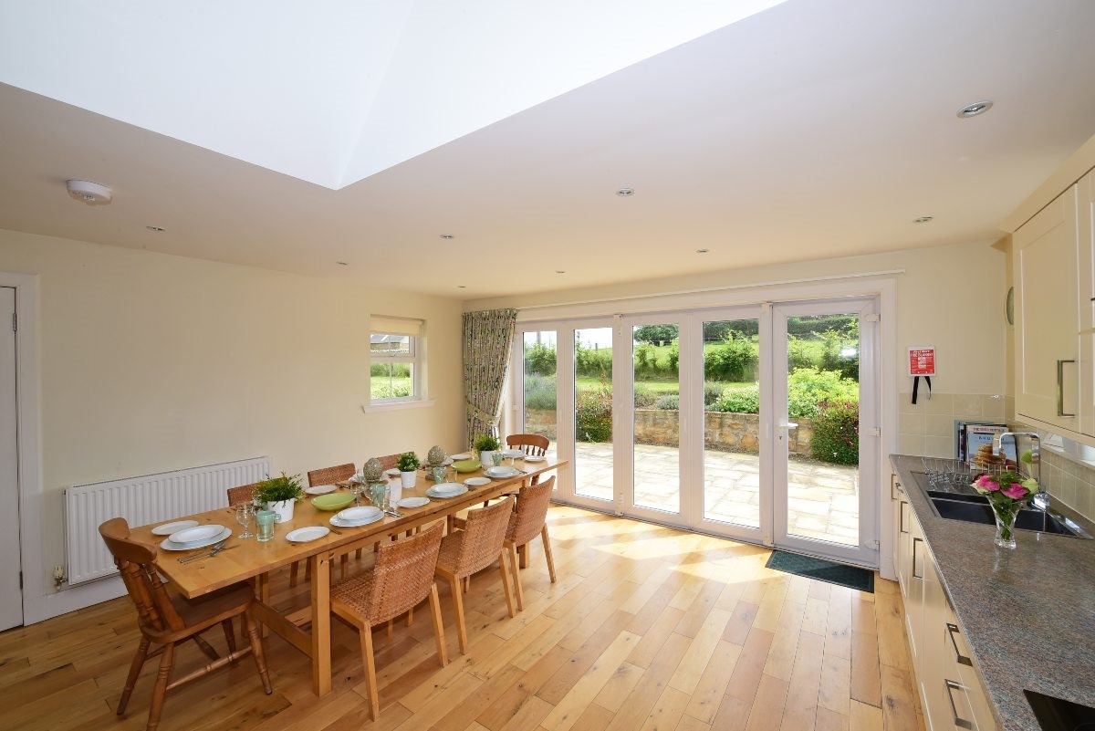 Hawthorn House - view out to the garden and patio area from the spacious kitchen