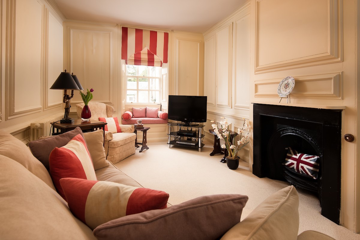 Eslington East Wing - first floor sitting room with comfortable seating and TV