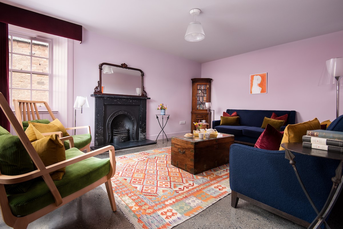 Papple Steading - Grieve's Cottage - sitting room with an open-fire and seating for eight guests