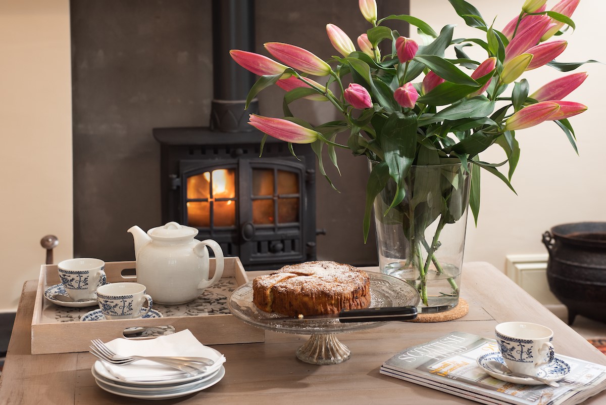 Goose Cottage - tea and cake in front of the cosy wood burner
