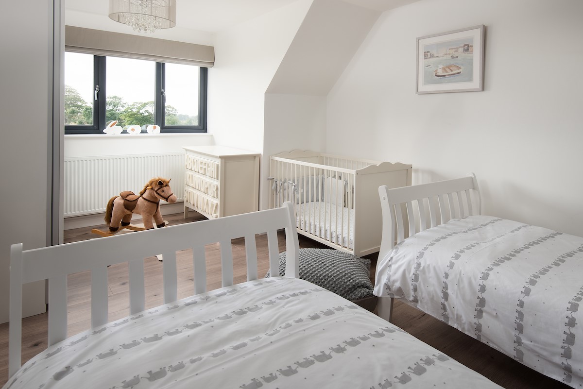 Sunwick Cottage - bedroom three with fixed 3' twin beds and a separate full size cot