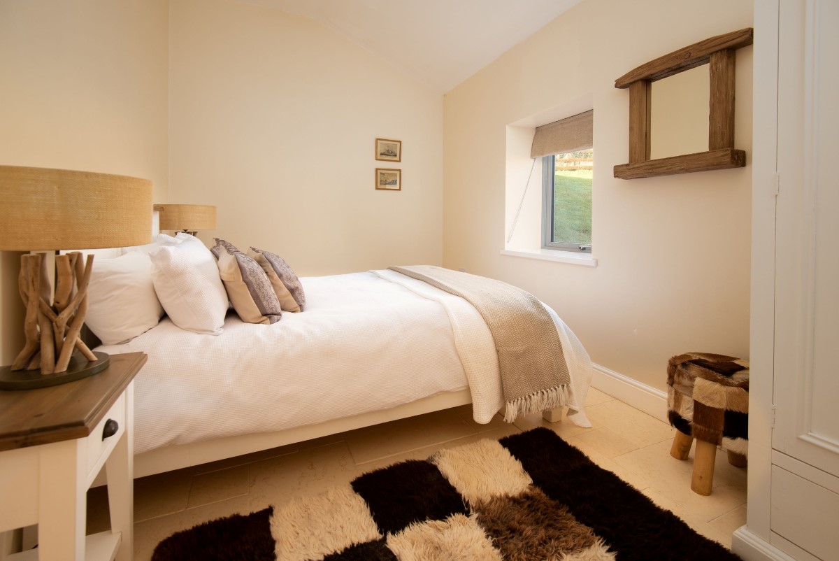 Leyland Barn - bedroom one with comfortable king size bed