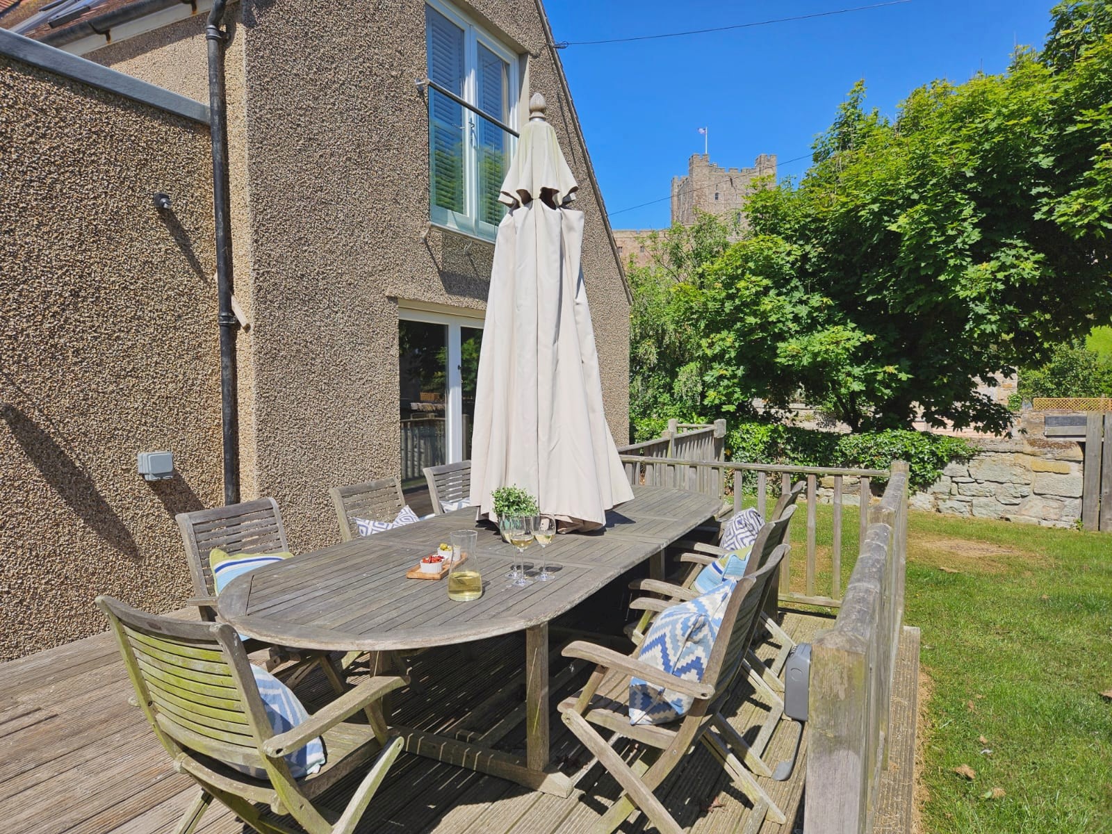 Greystead - Outdoor dining table and views of Bamburgh Castle from the garden
