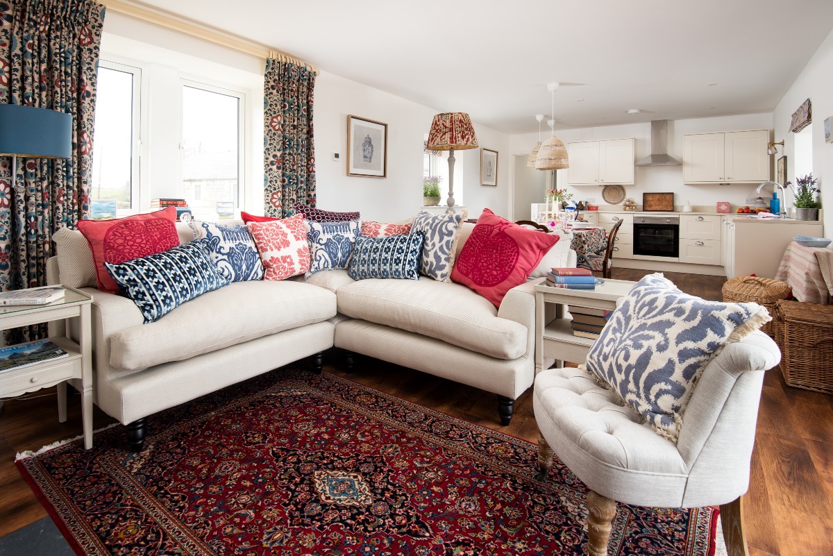 Brunton Lake - comfortable seating in the sitting room with corner sofa and armchair